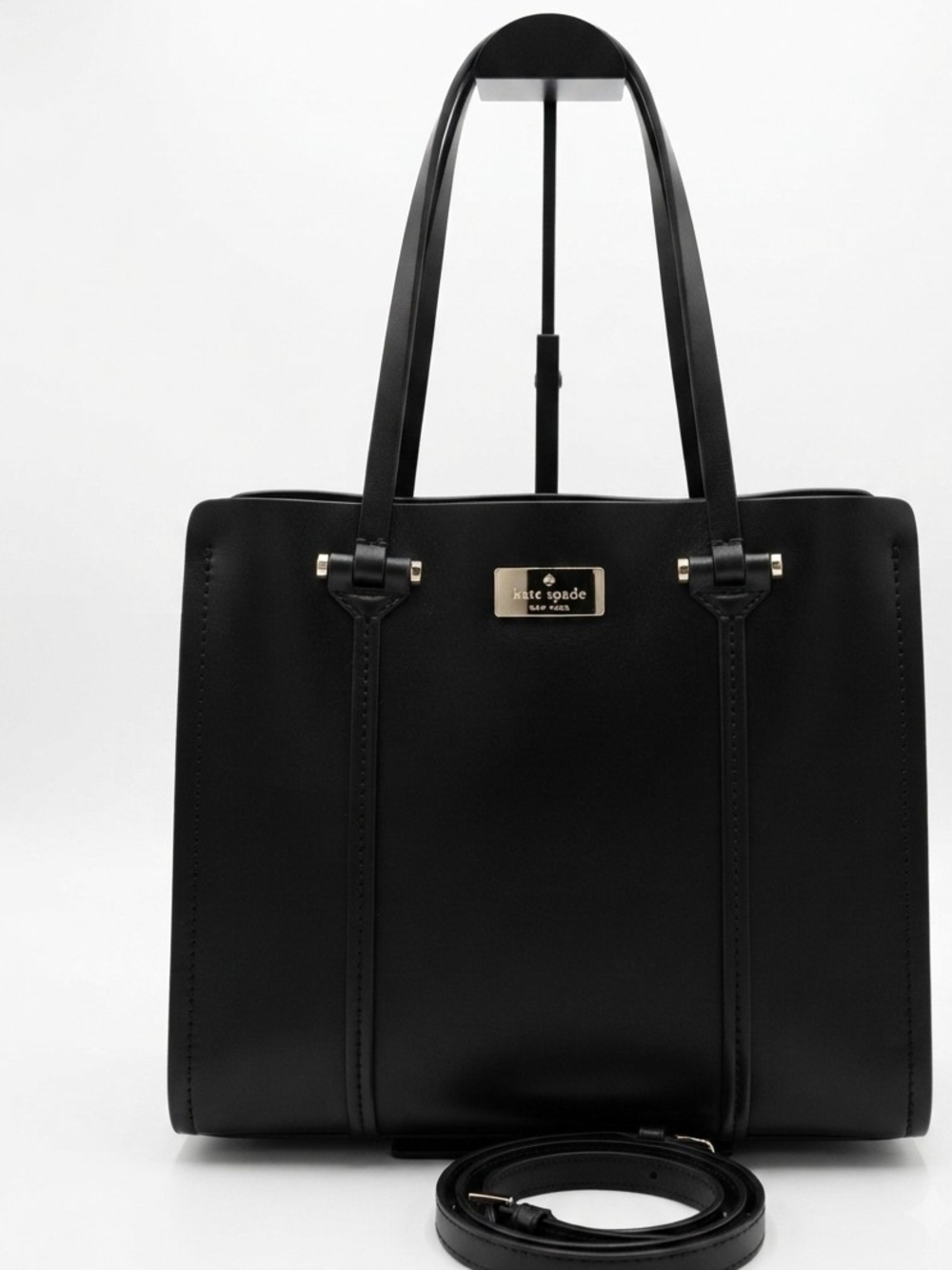 Kate Spade New York black leather tote bag with shoulder strap
